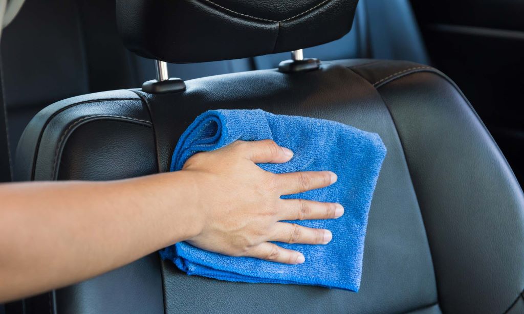 What do professionals use to clean leather seats?