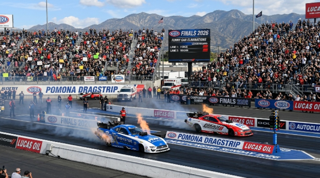 Packed grandstands of 40,000 fans watching side-by-side Funny Car eliminations on championship Sunday at the NHRA Finals 2026 at Pomona Dragstrip