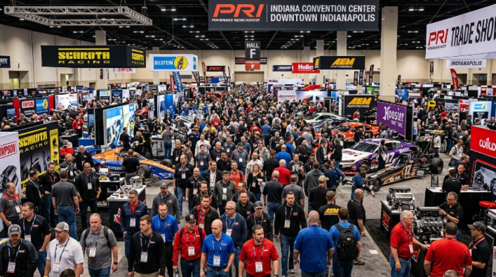 Thousands of motorsports professionals walking the packed exhibition floor at the Indiana Convention Center during the PRI Show 2026 in downtown Indianapolis, Indiana